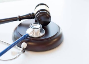 Gavel and stethoscope. medical jurisprudence. legal definition of medical malpractice. attorney. common errors doctors, nurses and hospitals make.